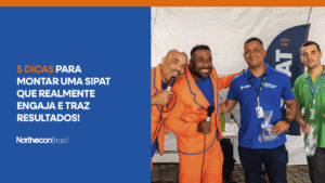 Dois palestrantes da SIPAT da Northecon tirando foto ao lado de dois funcionários da empresa Vibra, todos sorrindo, e o seguinte texto: 5 dicas para montar uma SIPAT que realmente engaja e traz resultados!